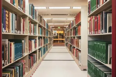 Shelves of books lining a library aisle